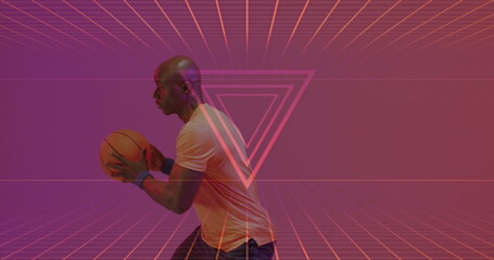 Image of neon pattern over african american basketball player