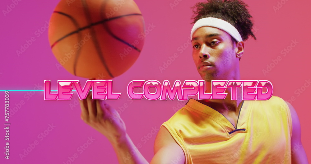 Poster image of level completed text over neon pattern and biracial basketball player