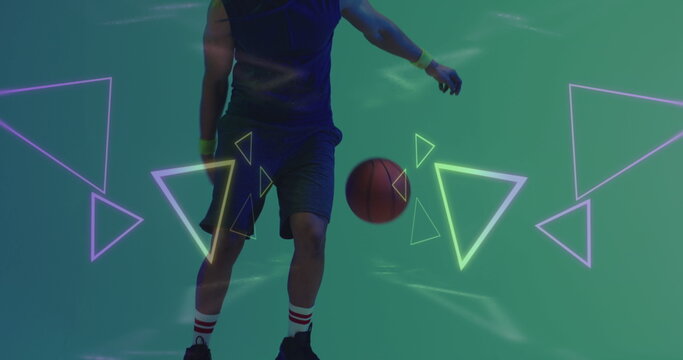 Image of neon pattern over african american basketball player