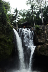 Fototapeta na wymiar View of a large tall waterfall in the jungle