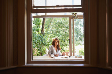 Window, nature and woman person journaling in home, porch or sun room for relax. Spring, writing...