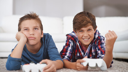 Happy, children and winning a video game in home with friends in online competition for esports...