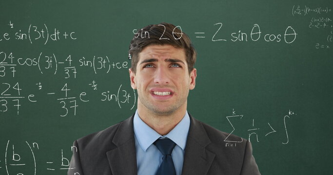 Confused male student with math equations on screen for back to school in 4k. - Powered by Adobe