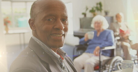 Image of glowing light over portrait of happy senior man