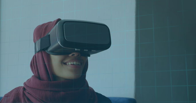 Image of 6g text, scopes scanning and data processing over woman in hijab wearing vr headset