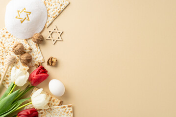 Graceful Passover arrangement, top view shot. Includes ribboned matzah, rwalnuts, egg, star of David, yarmulke, white and red tulips on a gentle beige background, space for copy - obrazy, fototapety, plakaty