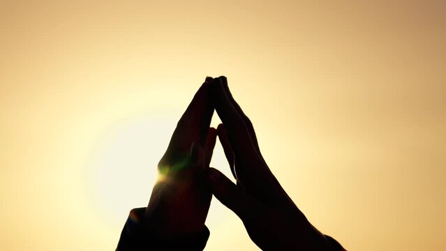Happy family concept. joined hands of a young couple at sunset. feelings of love and trust. demonstrate support and understanding. closeness to each other. way to success. joint achievement of a goal
