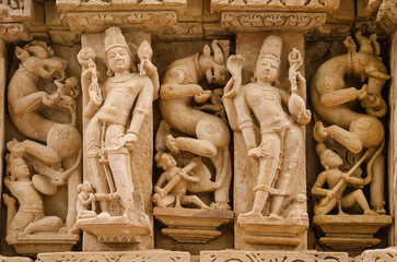Stone carved sculpture on the outer wall of The Parshwanath temple, Adinath temple, Jain temple,...