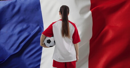 Obraz premium Image of caucasian female soccer player over flag of france