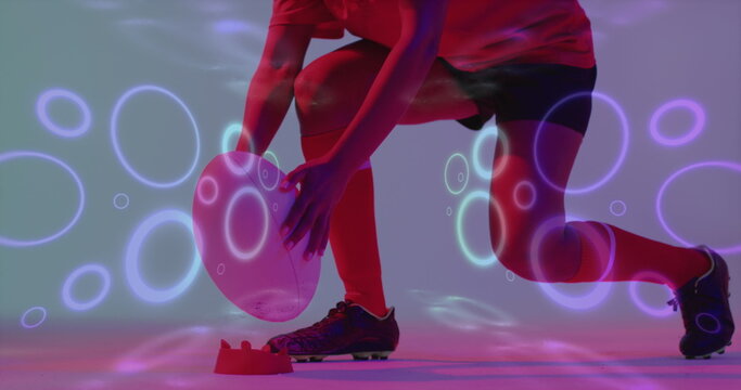 Image of neon pattern over female rugby player on neon background - Powered by Adobe