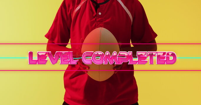 Image of level completed text over female rugby player on neon background