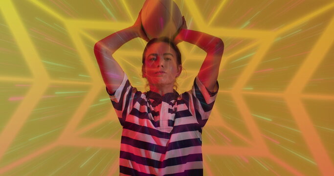 Image of neon pattern over female rugby player on neon background - Powered by Adobe