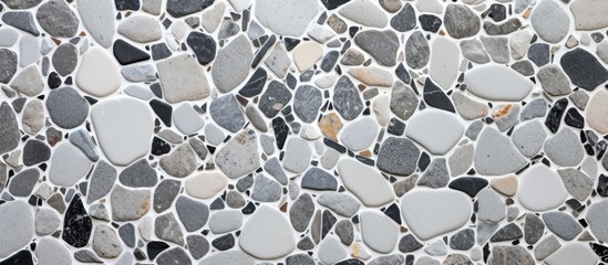 A closeup shot of a grey rock wall, showcasing the natural beauty of this building material. The rectangular rocks are arranged in a pattern, creating a textured and sturdy wall