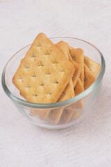 Delicious Biscuit Cracker with sugar on glass bowl