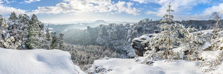 Snowy winter landscape in the Elbe Sandstone Mountains (Elbsandsteingebirge), Saxon Switzerland (Sächsissche Schweiz), Saxony, Germany