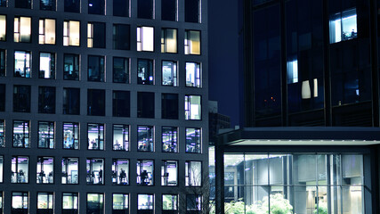 Office building at night, building facade with glass and lights. View with illuminated modern skyscraper. - 757818838