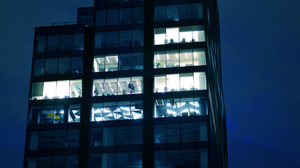 Office building at night, building facade with glass and lights. View with illuminated modern skyscraper. - 757818897