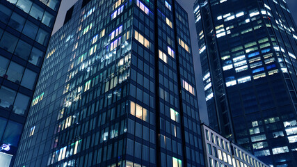Office building at night, building facade with glass and lights. View with illuminated modern skyscraper. - 757819062