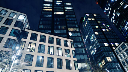 Office building at night, building facade with glass and lights. View with illuminated modern skyscraper. - 757819653