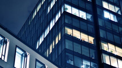 Office building at night, building facade with glass and lights. View with illuminated modern skyscraper. - 757820417