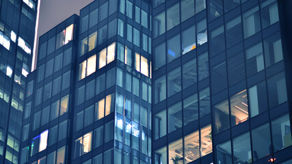 Office building at night, building facade with glass and lights. View with illuminated modern skyscraper. - 757820464