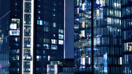 Office building at night, building facade with glass and lights. View with illuminated modern skyscraper. - 757820605