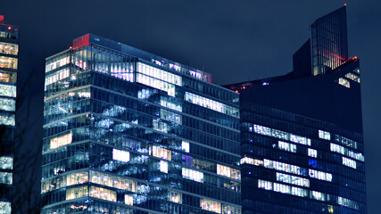 Office building at night, building facade with glass and lights. View with illuminated modern skyscraper. - 757820854