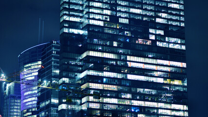 Office building at night, building facade with glass and lights. View with illuminated modern skyscraper. - 757820856