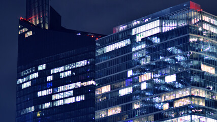 Office building at night, building facade with glass and lights. View with illuminated modern skyscraper. - 757820867