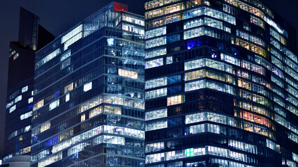 Office building at night, building facade with glass and lights. View with illuminated modern skyscraper. - 757821022