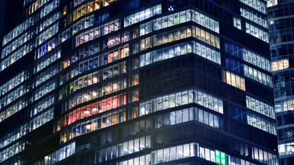Office building at night, building facade with glass and lights. View with illuminated modern skyscraper. - 757821203
