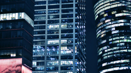 Office building at night, building facade with glass and lights. View with illuminated modern skyscraper. - 757821428