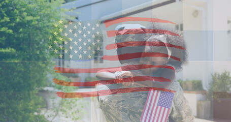 Image of flag of usa waving over crying african american soldier and his daughter