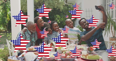 Image of stars with flag of united states of america waving over smiling african american family