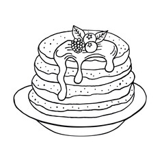 black and white pancakes with syrup and berries