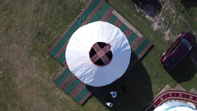 Yurt top view. Traditional houses of nomads. 4k drone from roof to general view from above