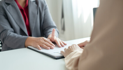HR Manager talks to job applicants for job interviews about careers and Her personal history in the...