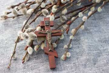 Crucifixion on the cross and prayer book. Burning church candle and willow twigs, Orthodox fast