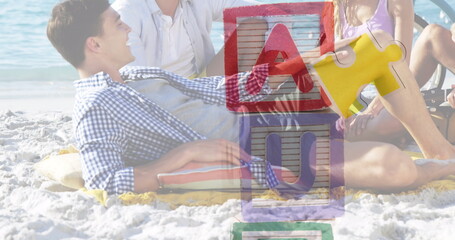 Image of colourful puzzle pieces and autism text over happy friends at summer beach party - Powered by Adobe