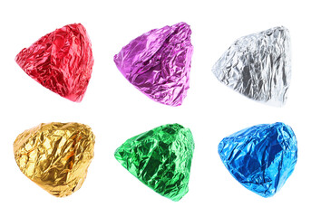 Tasty candies in bright wrappers isolated on white, set