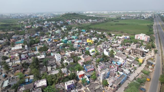 Aerial Shot of Indian Slum near a higway in India