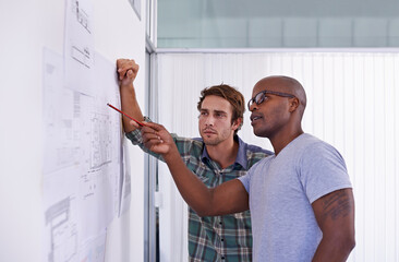 Architecture, men and teamwork with blueprint in office for building design, remodeling project and...