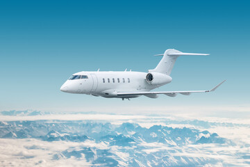 White modern luxury executive aircraft fly over snow covered mountains