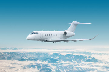 Obraz premium White modern luxury executive aircraft fly over snow covered mountains