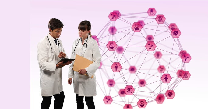 Doctors discuss global medical research on a tablet, surrounded by digital icons. - Powered by Adobe