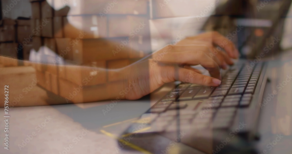 Poster image of person typing on computer keyboard with stacks of boxes in warehouse