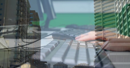 Image of woman typing on computer keyboard with cityscape in background