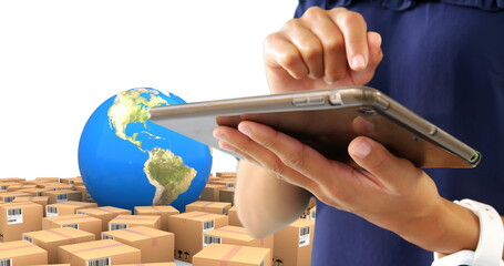 Image of man using tablet with stacks of boxes and globe on white background