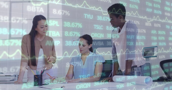 Image of financial data and graphs over diverse female coworkers in office