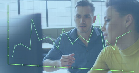 Image of financial data processing over diverse business people discussing work at office